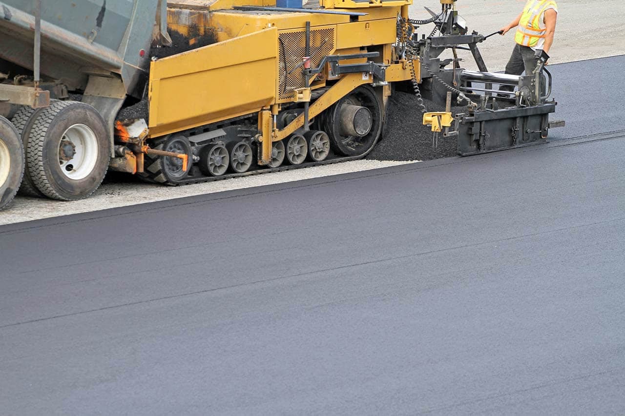 Asphalt Services crews working in Grand Prairie, TX